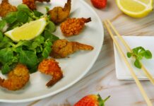 다이어트 중에도 지속 가능한 식단 짜기 팁 a white plate topped with shrimp and greens