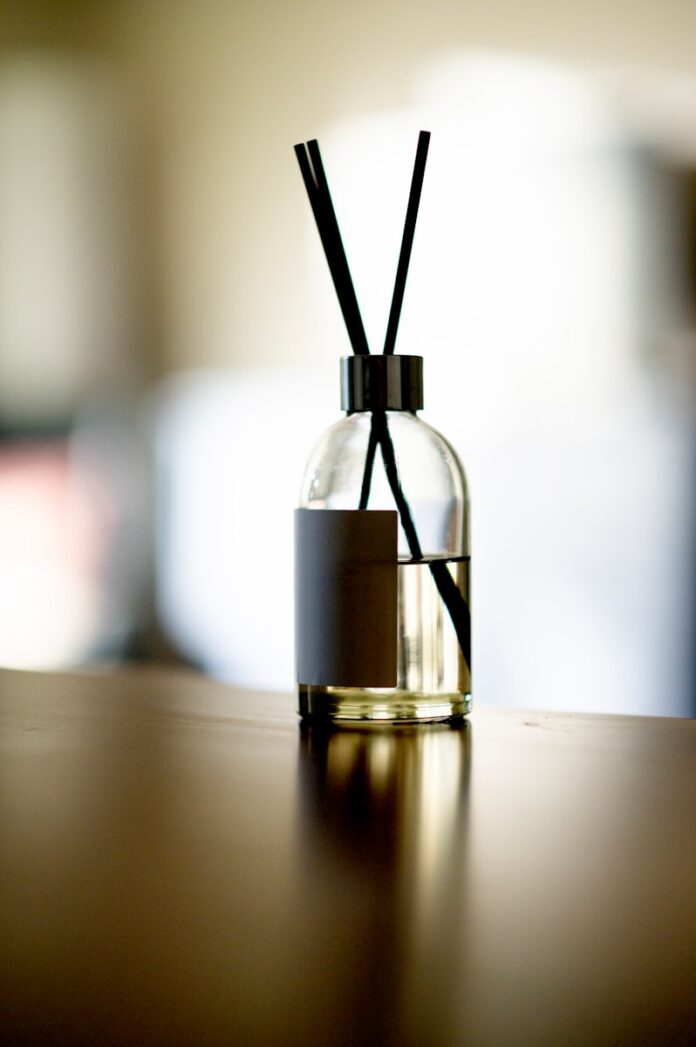 clear glass bottle with gold lid