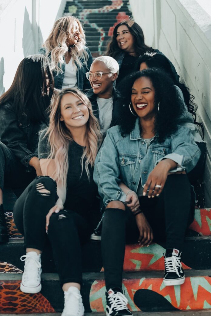 group of women laughing on stairs